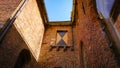 A Look At The Walls, Entrance And Roof Of An Ancient Brick Christian Church In Bruges, Belgium