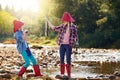 Look what I caught. two young girls fishing by a river. Royalty Free Stock Photo