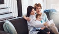 Look who came for a visit. a young woman taking selfies with her baby girl and mother at home. Royalty Free Stock Photo