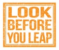 LOOK BEFORE YOU LEAP, text on orange grungy stamp sign