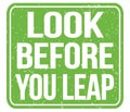 LOOK BEFORE YOU LEAP, text written on green stamp sign Royalty Free Stock Photo