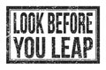 LOOK BEFORE YOU LEAP, words on black rectangle stamp sign Royalty Free Stock Photo