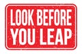 LOOK BEFORE YOU LEAP, words on red rectangle stamp sign Royalty Free Stock Photo