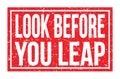 LOOK BEFORE YOU LEAP, words on red rectangle stamp sign Royalty Free Stock Photo
