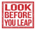 LOOK BEFORE YOU LEAP, text on red grungy stamp sign