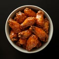 Looking at from above order of buffalo wings dark background