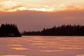 Sunset Reflected In The Ice On Island Lake Royalty Free Stock Photo