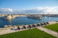 Guns across Malta`s Grand Harbour; views of Birgu and Senglea