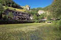 Cheddar Gorge England. Peaceful view across pond to gorge.