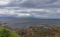 Looking across to the the island of Stroma, part of the Orkneys from the rocky beach at John OÃ¢â¬â¢Groats. Royalty Free Stock Photo