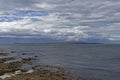 Looking across to the the island of Stroma, part of the Orkneys from the rocky beach at John OÃ¢â¬â¢Groats. Royalty Free Stock Photo