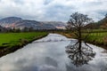 Looking along Goldrill Beck in Cumbria, with reflections in the water