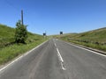 Huddersfield Road, with moorland, and a blue sky in, Denshaw, Oldham, UK Royalty Free Stock Photo
