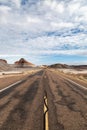 Looking along a road through The Painted Desert in Arizona Royalty Free Stock Photo