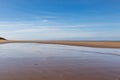 Looking along the sandy beach at Formby, at low tide Royalty Free Stock Photo