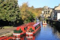 Looking along Springs Canal, a short branch off the Leeds and Liverpool Canal in Skipton, North Yorkshire with several canal boats