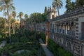 Seville, Spain, September, 29, 2017: Looking alongside the ornate internal wall of the gardens inside the Royal Alcazar