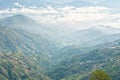 Looking at amazing view of clouds on the Himalayas and rice terraces in Nagarkot in Nepal. Royalty Free Stock Photo