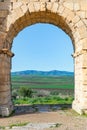 A View Through the Arch of Caracalla at the Roman Ruins of Volubilis in Morocco Royalty Free Stock Photo