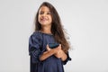 Portrait of one cute Caucasian preschool girl in beautiful blue dress with smartphone isolated over white studio Royalty Free Stock Photo