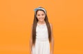 Looking beautiful. Happy girl with cute look. Beauty look of little child. Small fashion model yellow background. Vogue