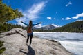 Young woman with raised hands relaxing on top of the mountain Royalty Free Stock Photo