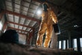 Looking below at the object. Man dressed in chemical protection suit in the ruins of the post apocalyptic building Royalty Free Stock Photo