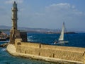 Looking beyond the sea wall of Chania harbour, Crete towards the Mediterranean on a bright sunny day Royalty Free Stock Photo