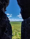 Looking through cave crack from the small mountain Regenstein in Germany Royalty Free Stock Photo