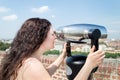 Looking the cityscape with binoculars Royalty Free Stock Photo