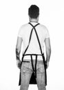 Looking cool while working. Working man or worker back view. Man wearing apron with straps on back. Man standing face