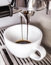 Looking into cup as espresso coffee for flat white is being made Royalty Free Stock Photo
