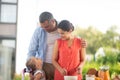 Parents looking at daughter before having breakfast outside