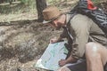 Concentrated hiker is spending time in woods