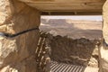 Looking through a doorway in Masada to the Judean Desert beyond
