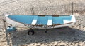 Looking down from above at the aqua colored inside of a rowboat on the sand at Sunken Meadow