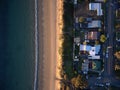 Looking down with a birds eye view of the beach and houses