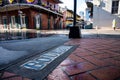 Looking Down Bourbon Street From Tiles in Sidewalk Royalty Free Stock Photo