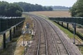 Double rail tracks curving left with ramps for horse to cross the line Trimley.