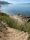 Limestone steps lead to the beach, Split, Croatia (c) 2020, Cyndie Burkhardt. Royalty Free Stock Photo