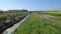 Looking down ditch in countryside setting