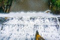 Looking down at the flow of water falling over a concrete dam, San Francisco bay area, California Royalty Free Stock Photo