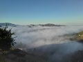 Looking Down on Fog and Clouds Creeping along the Hills and Valley