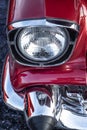 Looking down front chrome headlight and bumper 1957 chevy Bel air classic muscle car Royalty Free Stock Photo