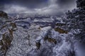 Looking down into the Grand Canyon in the snow Royalty Free Stock Photo