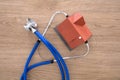 Looking down a house model with a stethoscope on the table Royalty Free Stock Photo