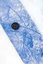 An ice hockey puck at the blue line Royalty Free Stock Photo