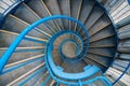 Blue long spiral staircase from above