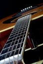 Looking down neck of acoustic guitar Royalty Free Stock Photo