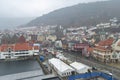 Bergen, Norway - 13th April 2011: Looking down over the Fish Market of Bergen City on a wet, misty day, with People shopping. Royalty Free Stock Photo